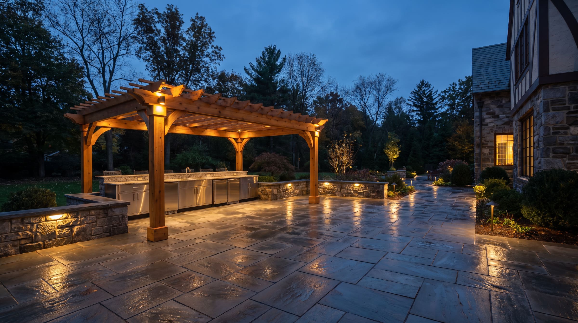 3,100 SF surround, 16 LF kitchen, cedar pergola in Franklin Lakes at dusk — stand-in art at final crop